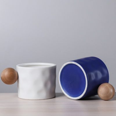 330ml Blue And White Ceramic Coffee Mug With Wooden Spherical Handle For Business Gifting